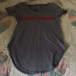 Black and white thin striped top with red letters